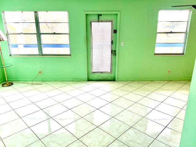 empty room with light tile patterned floors