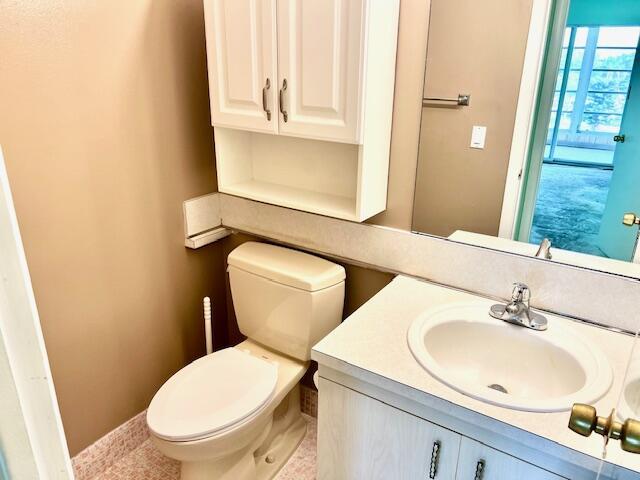 bathroom featuring vanity and toilet