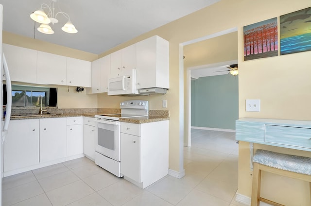 kitchen with white cabinets, pendant lighting, white appliances, and sink