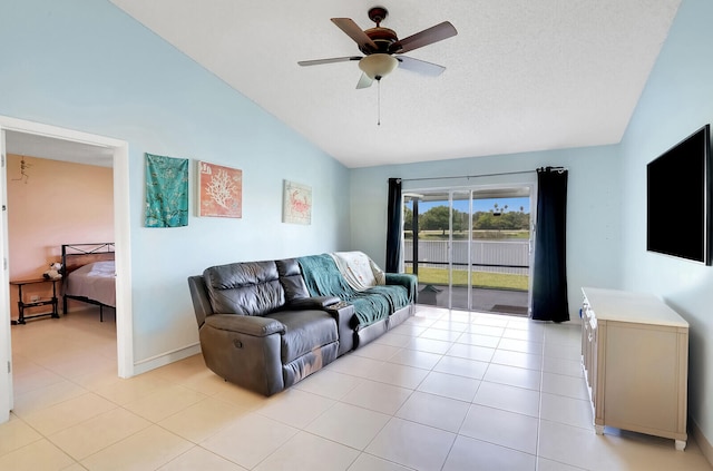 tiled living room with vaulted ceiling and ceiling fan