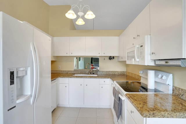 kitchen with white appliances, an inviting chandelier, white cabinets, sink, and hanging light fixtures