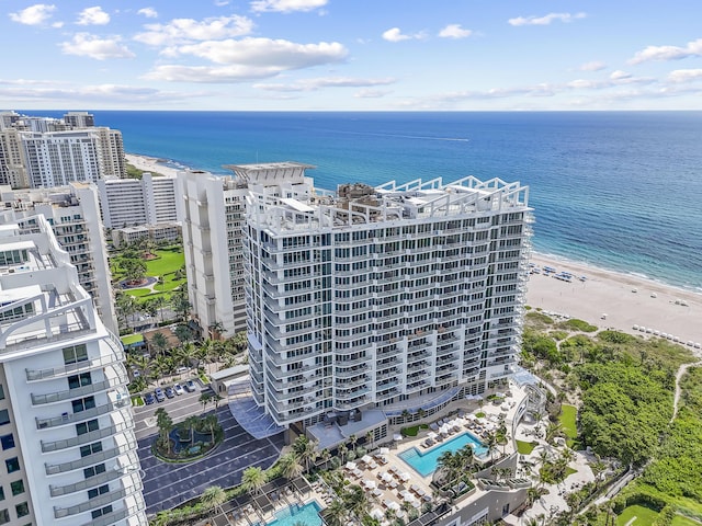 aerial view with a water view and a view of the beach