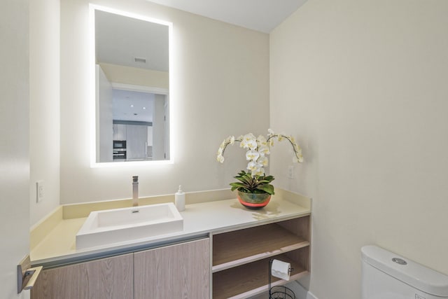 bathroom with vanity and toilet