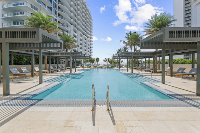 view of swimming pool featuring a patio area