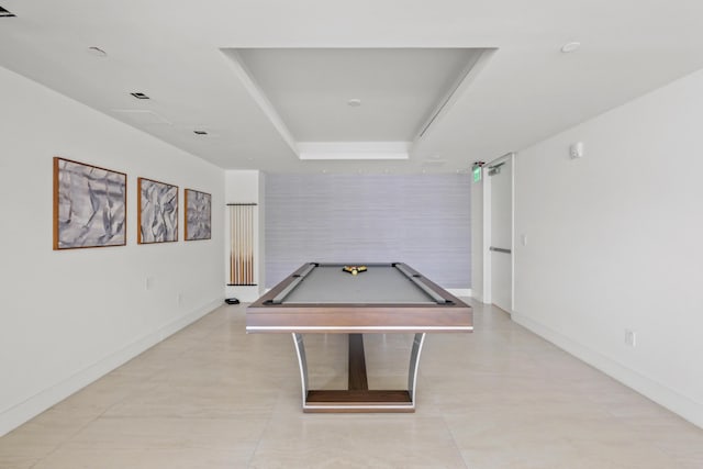 rec room with a raised ceiling and pool table