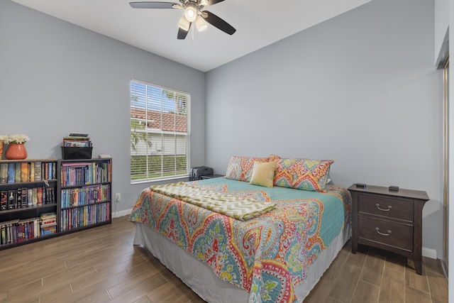 bedroom featuring hardwood / wood-style flooring and ceiling fan