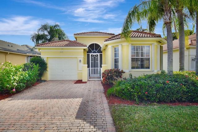 mediterranean / spanish-style home featuring a garage