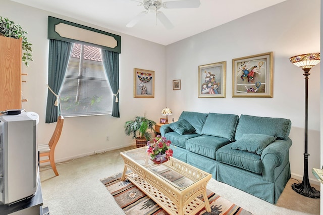 carpeted living room with ceiling fan and heating unit