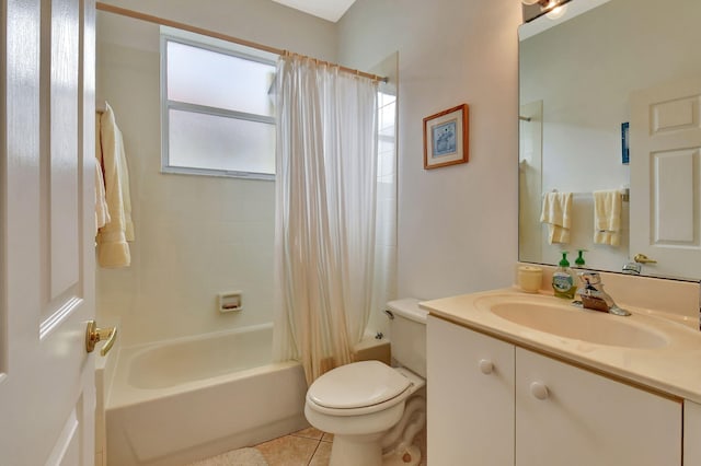 full bathroom featuring toilet, shower / bath combo with shower curtain, tile patterned floors, and vanity