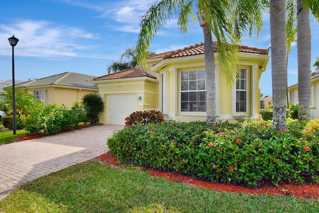 view of front of home with a garage