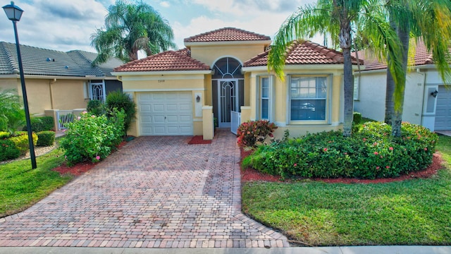 view of front of house featuring a front lawn and a garage