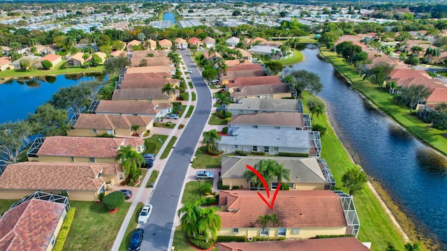 birds eye view of property featuring a water view