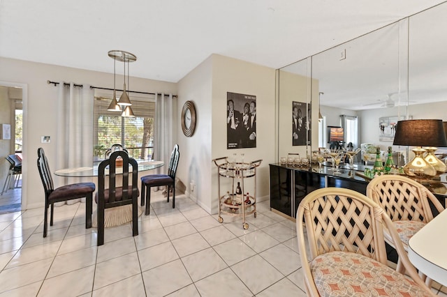 dining room with ceiling fan and light tile patterned floors