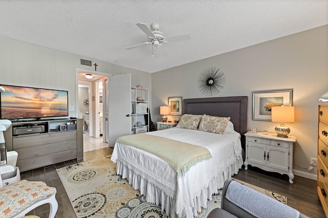 bedroom featuring ceiling fan and a textured ceiling