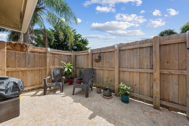 view of patio / terrace featuring fence