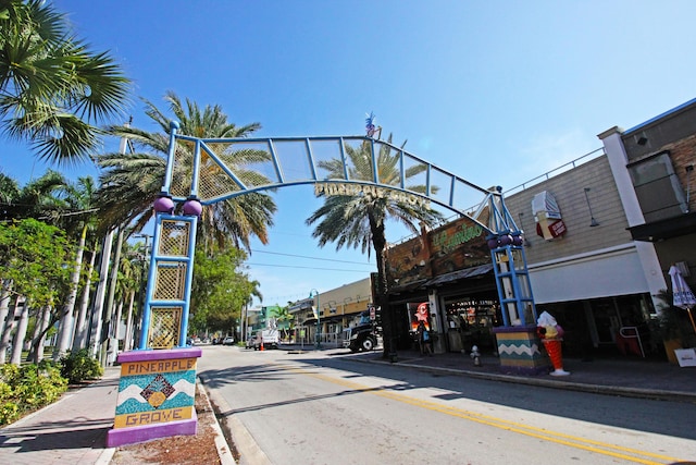 view of street with sidewalks, street lighting, and curbs