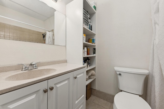 bathroom featuring tile patterned flooring, curtained shower, vanity, and toilet