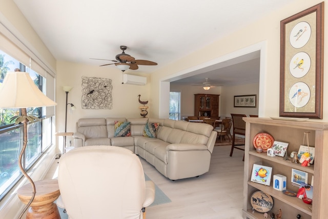 living room featuring ceiling fan and a wall mounted air conditioner