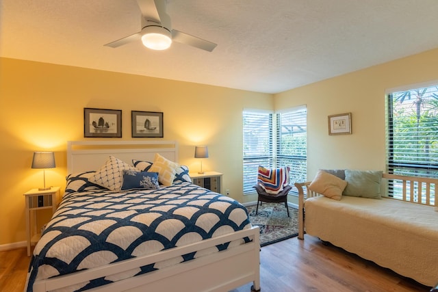 bedroom featuring ceiling fan and wood-type flooring