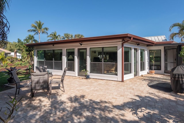 rear view of property featuring a patio