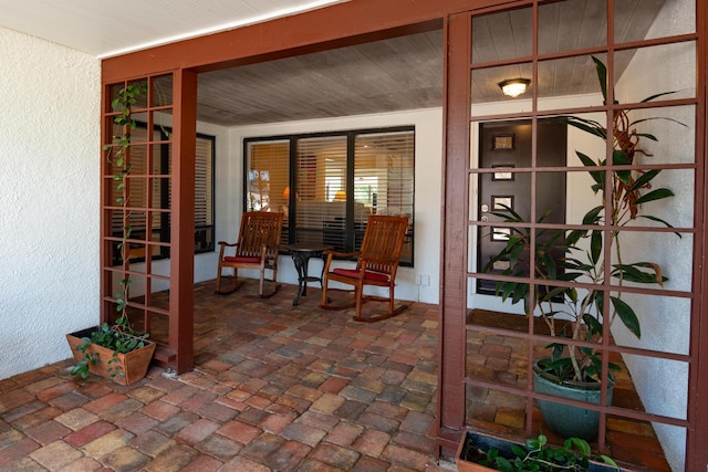 view of patio featuring a porch