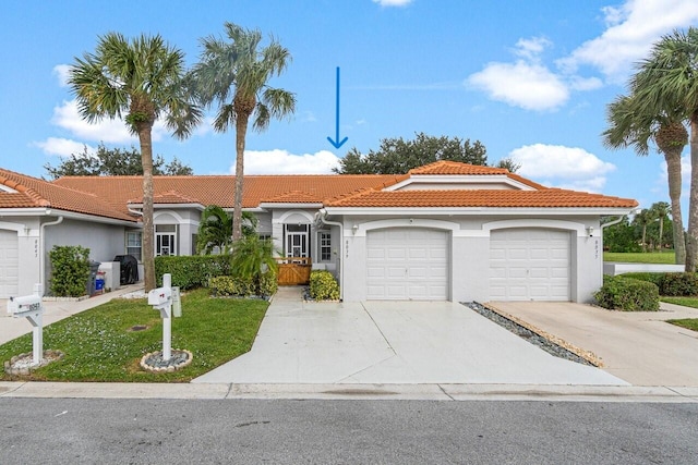 view of front facade featuring a garage and a front yard