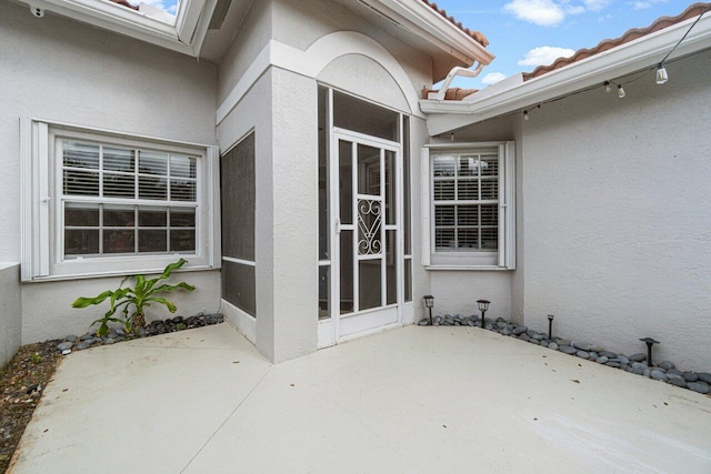 doorway to property with a patio