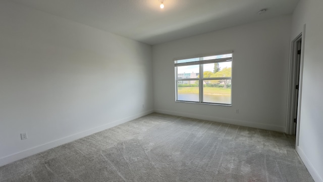 spare room featuring carpet flooring