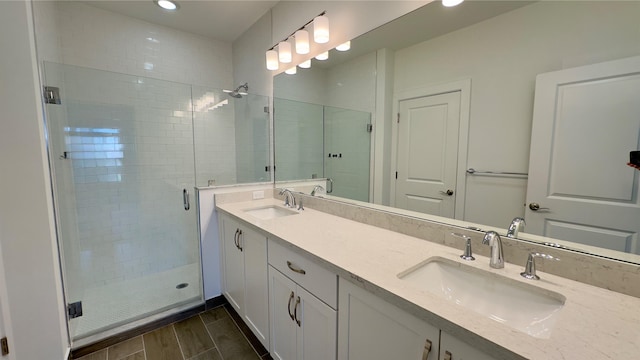 bathroom with vanity and a shower with shower door