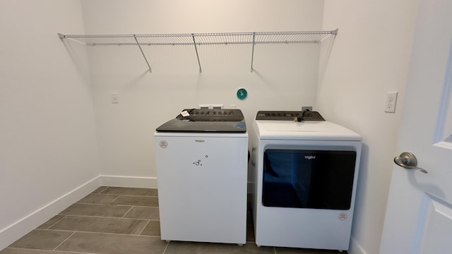 clothes washing area featuring washer and clothes dryer