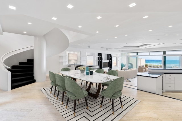 dining area featuring a raised ceiling