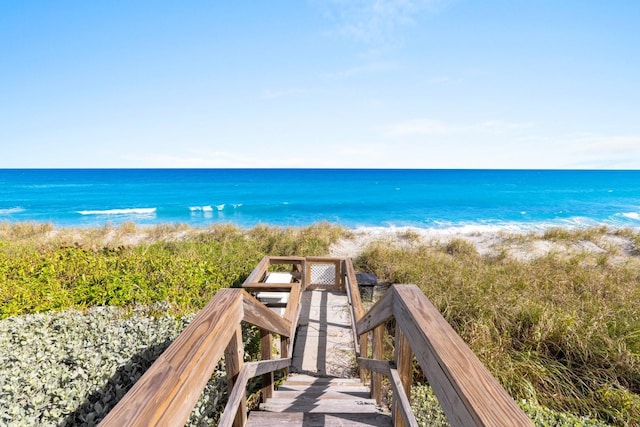 property view of water featuring a beach view