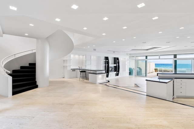 kitchen featuring white cabinetry and a large island