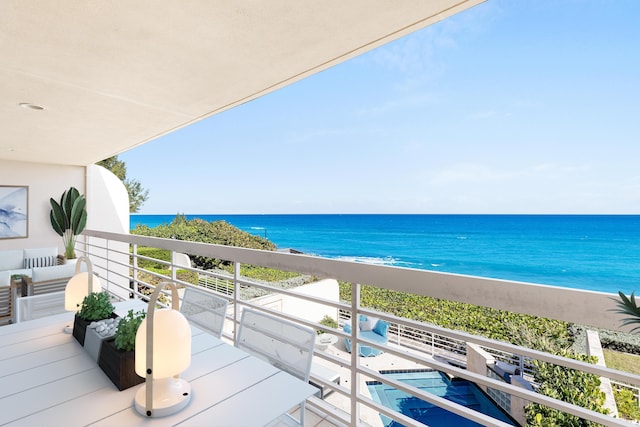 balcony featuring a water view and a beach view