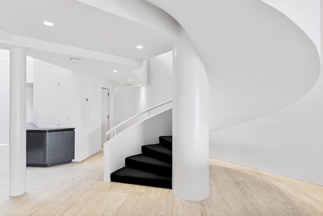 stairway featuring hardwood / wood-style floors