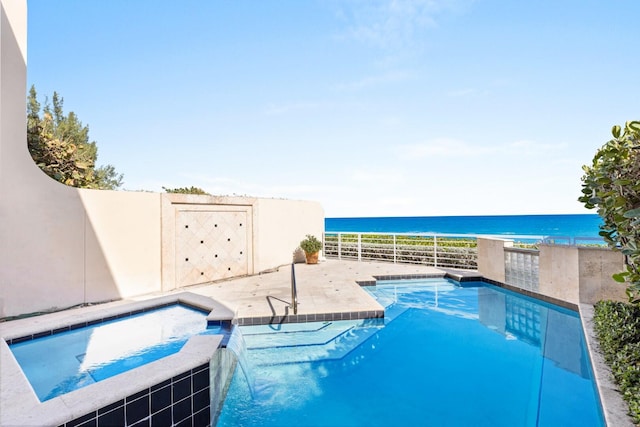 view of swimming pool with a water view