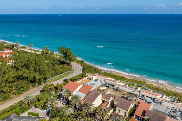 bird's eye view featuring a water view and a view of the beach