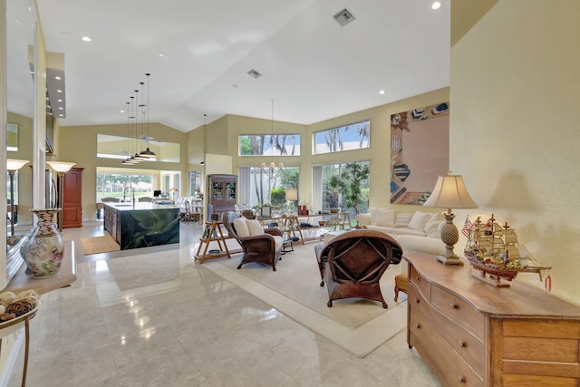 living area with high vaulted ceiling, recessed lighting, and visible vents