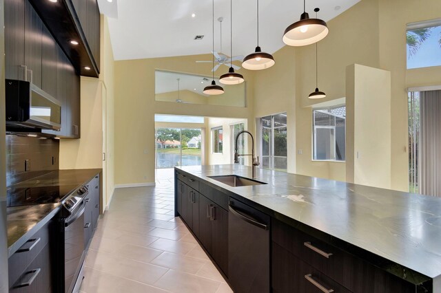 kitchen featuring pendant lighting, dark countertops, electric range, dark brown cabinetry, and modern cabinets