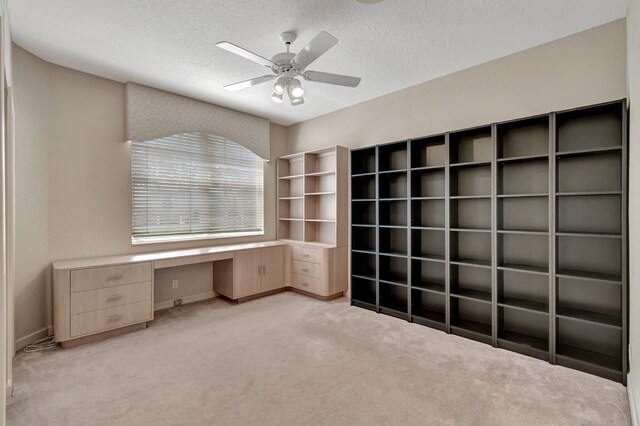 unfurnished sunroom with lofted ceiling, ceiling fan, and a water view