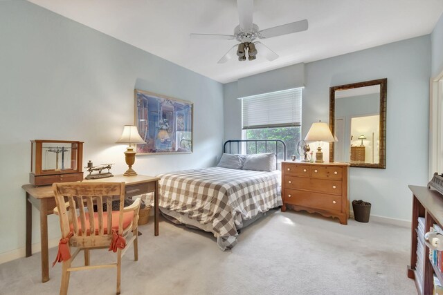 unfurnished bedroom featuring connected bathroom, sink, light carpet, a closet, and ceiling fan