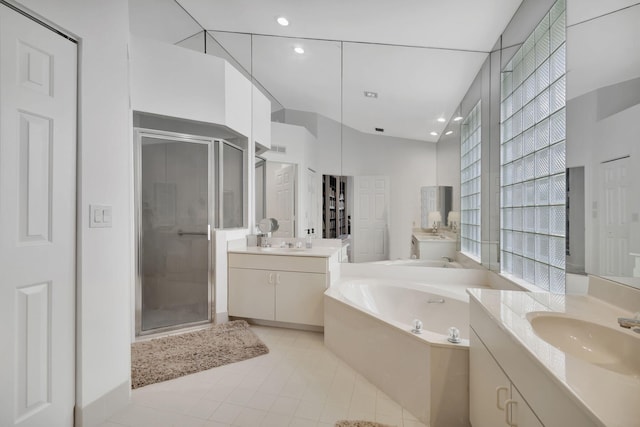 full bath featuring recessed lighting, a sink, two vanities, a shower stall, and a bath