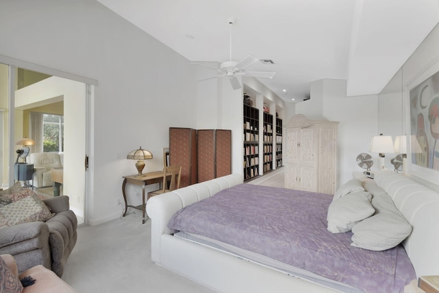 bedroom featuring light carpet, ceiling fan, and baseboards