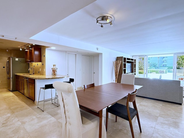 dining space with sink