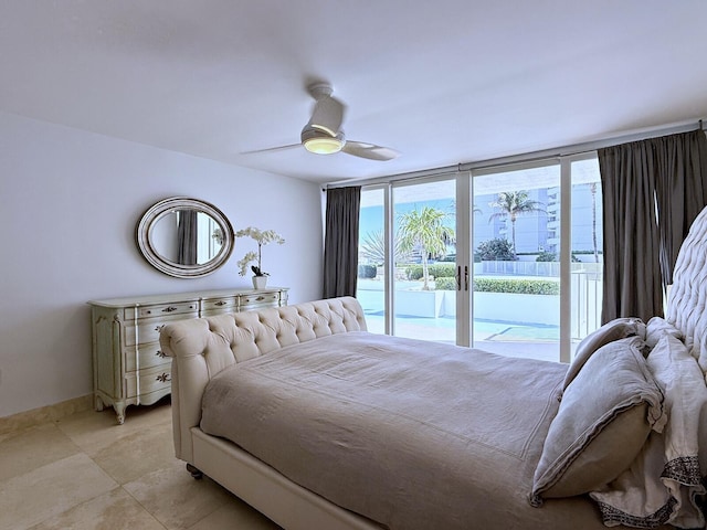 bedroom featuring access to outside, ceiling fan, light tile patterned floors, and a wall of windows