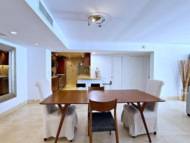 view of tiled dining space