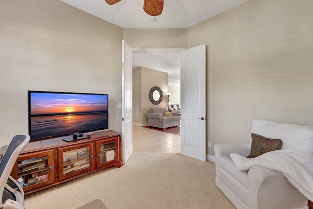 carpeted living room featuring ceiling fan