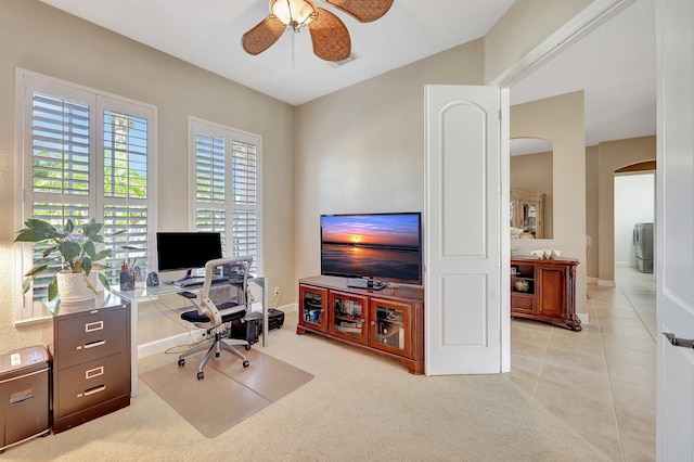 home office featuring ceiling fan, light colored carpet, and washer / clothes dryer