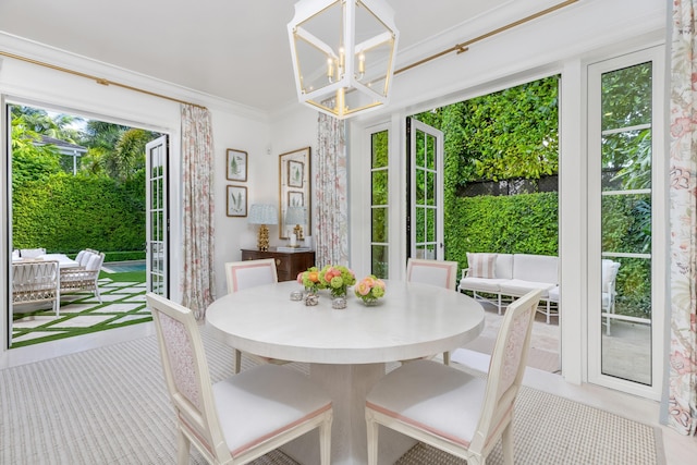 sunroom with an inviting chandelier