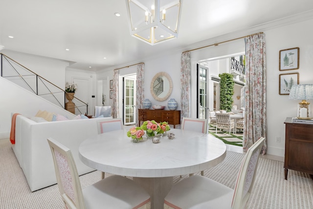 dining room featuring crown molding and a chandelier